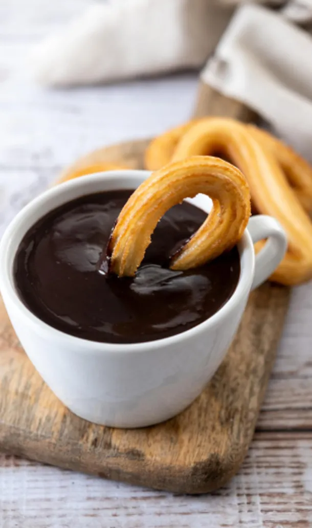 churros in chocolate mug